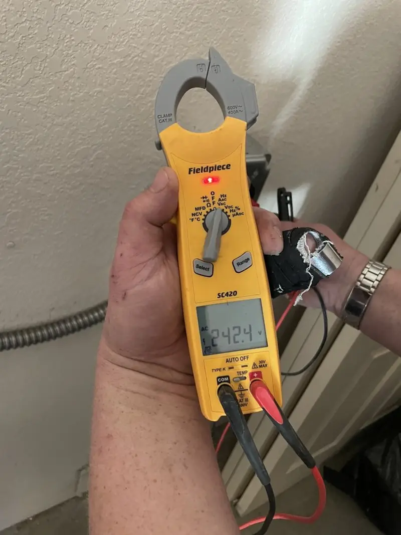 Voltage testing with clamp meter during Electrical Installation Services in Meridian
